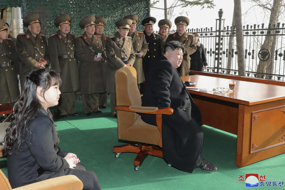 In this photo provided by the North Korean government, North Korean leader Kim Jong Un, with his daughter, inspects what it says is an artillery drill at an undisclosed location in North Korea, Thursday, March 9, 2023. Independent journalists were not given access to cover the event depicted in this image distributed by the North Korean government. The content of this image is as provided and cannot be independently verified. Korean language watermark on image as provided by source reads: "KCNA" which is the abbreviation for Korean Central News Agency. (Korean Central News Agency/Korea News Service via AP)