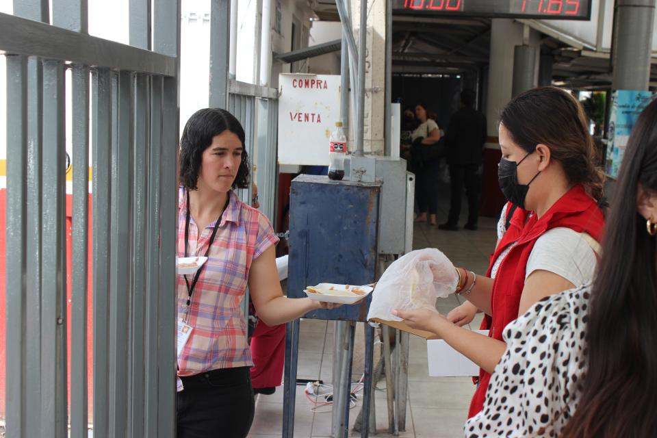 Joanna Williams, executive director of the Kino Border Initiative, helps prepare meals for about 200 asylum seekers waiting in line outside of the Dennis DeConcini Port of Entry in Nogales, Sonora, on Wednesday, May 17, 2023.