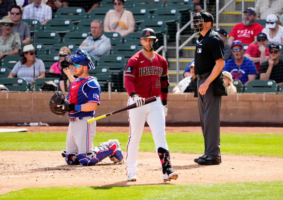 The Diamondbacks' Christian Walker strikes out against the Texas Rangers in the fourth inning during a spring training game at Salt River Fields on March 8.