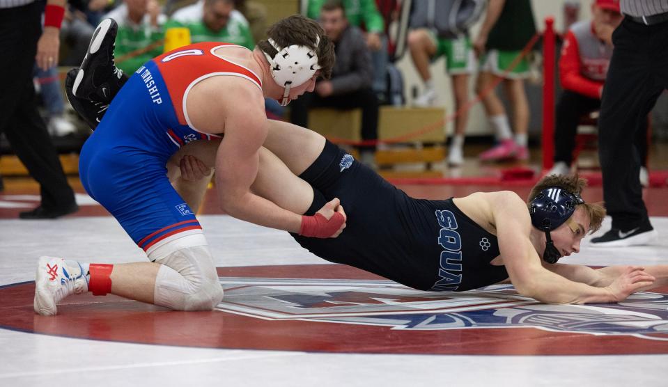 Ocean's James Farina (left) pinned Manasquan's Michael McNulty in the NJSIAA District 22 150-pound final.