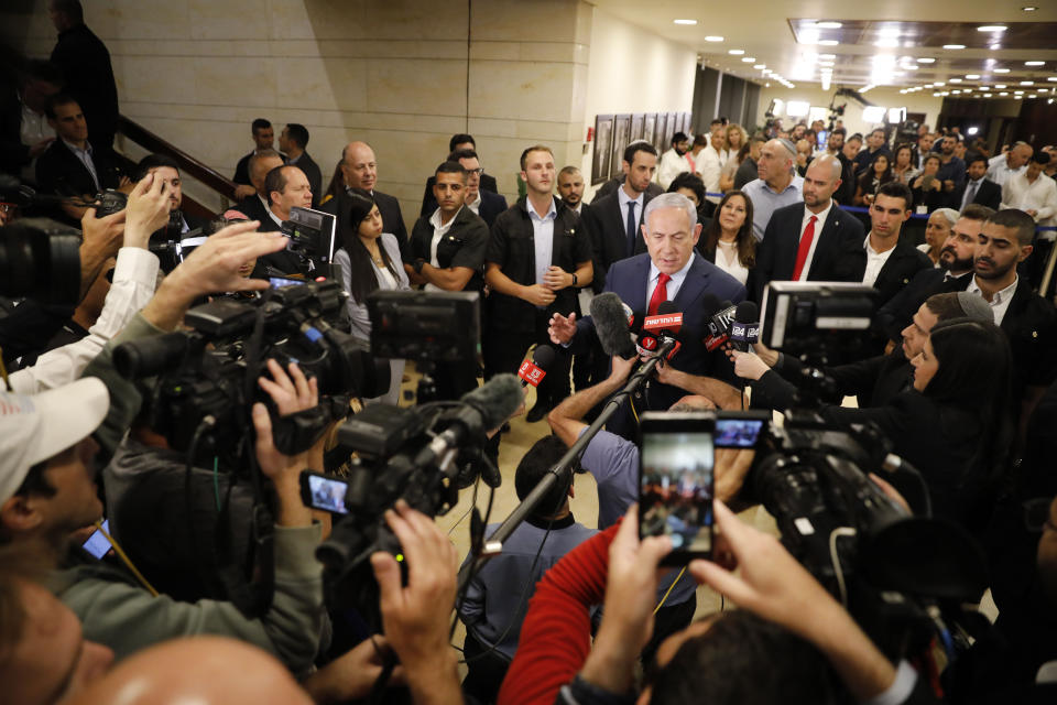 Israeli Prime Minister Benjamin Netanyahu speaks to the media after voting in the Knesset, Israel's parliament in Jerusalem, Thursday, May 30, 2019. Israel's parliament has voted to dissolve itself, sending the country to an unprecedented second snap election this year as Prime Minister Benjamin Netanyahu failed to form a governing coalition before a midnight deadline. (AP Photo/Sebastian Scheiner)