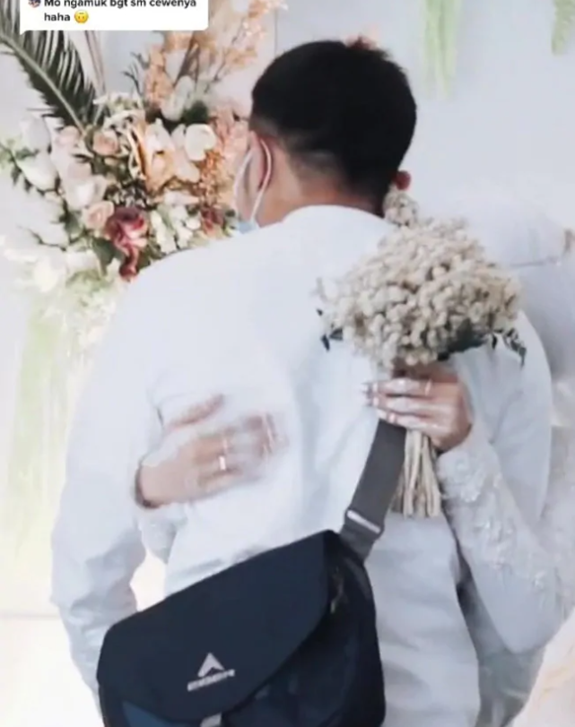 bride hugs ex boyfriend at wedding