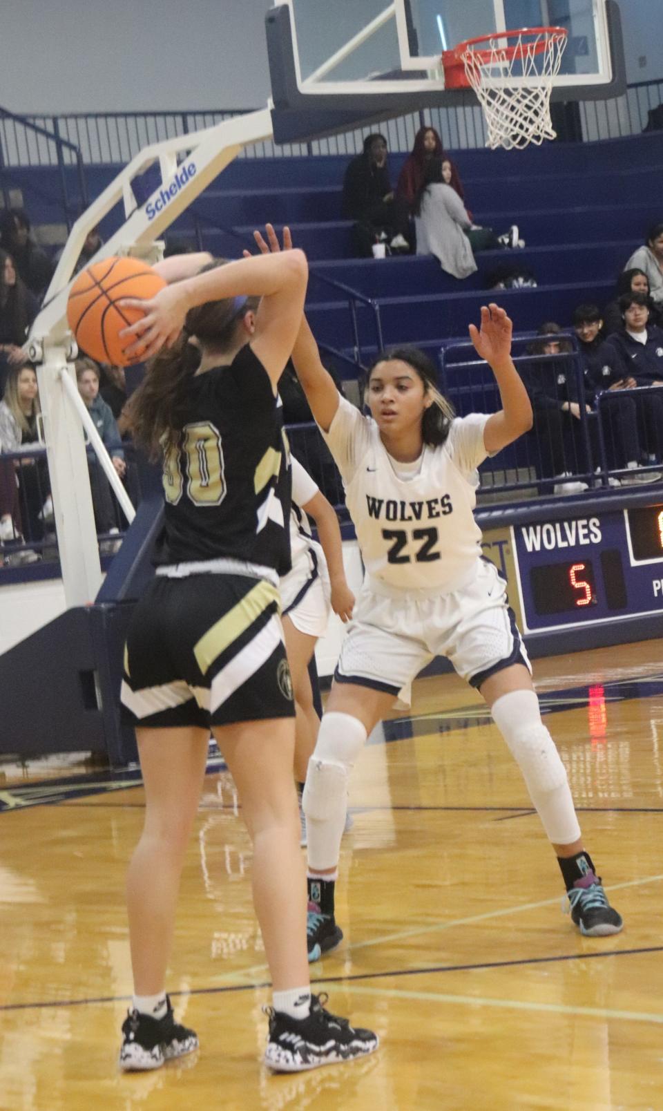 Shawnee's Amaya Martinez (22) guards McAlester's Elizabeth Milligan (11) Thursday morning in the first round of the Shawnee Invitational.