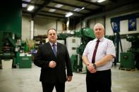 Managing Director of Bruderer Uk Ltd Adrian Haller and Service Manager Mark Crawford pose at the company's factory in Luton
