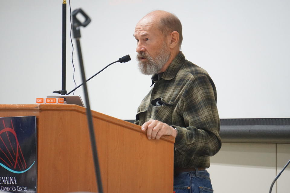 Retired Alaska Department of Fish and Game biologist Jim Dau, who studied the Western Arctic Caribou Herd for decades, speaks on March 7, 2024, at the annual meeting in Anchorage of Alaska's 10 regional subsistence advisory councils. (Photo by Yereth Rosen/Alaska Beacon)