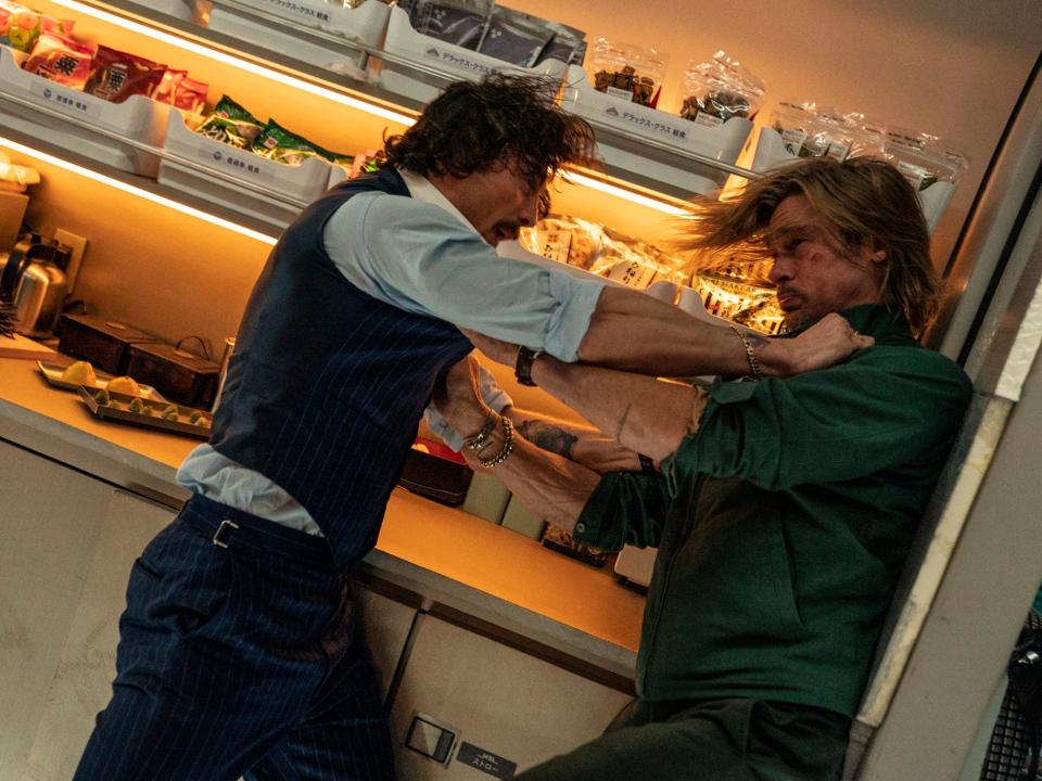 Aaron Taylor-Johnson and Brad Pitt fight in a train