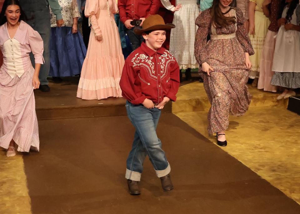 Mia Nadeau, Gus Van Buskirk, and Fiona McCray dancing in "Oklahoma" at the Academy of Performing Arts in Orleans.