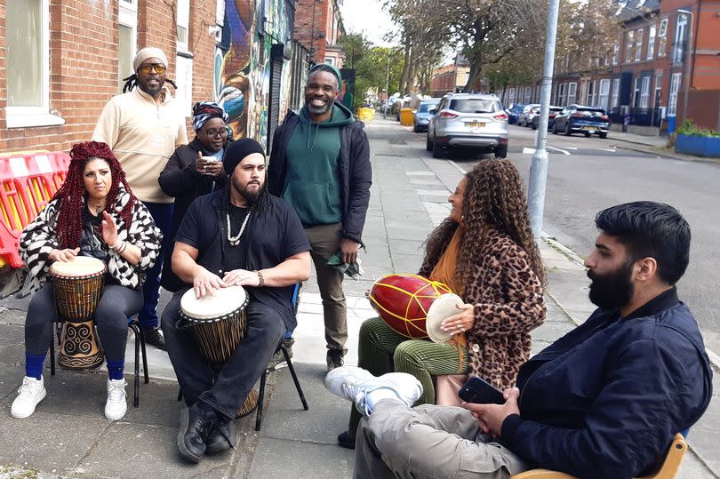 Addae G (back left) with drummers who provided musical entertainment at the Postcode Gardener Healing Garden event in Toxteth (Image: Patrick Graham/Liverpool ECHO)