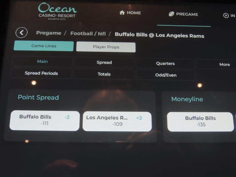 FILE - Odds on a Buffalo Bills-Los Angeles Rams football game are shown on a kiosk at the Ocean Casino Resort in Atlantic City N.J., Sept. 6, 2022. Americans have bet over $220 billion on sports with legal gambling outlets in the five years since the U.S. Supreme Court cleared the way for all 50 states to offer it. (AP Photo/Wayne Parry, File)