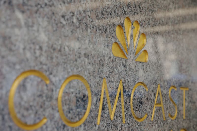 The NBC and Comcast logos are displayed on 30 Rockefeller Plaza in midtown Manhattan in New York