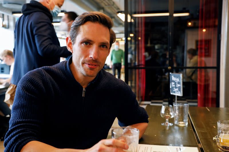 Chief Executive Officer of medical company Practio enjoys a beer at a bar in Copenhagen