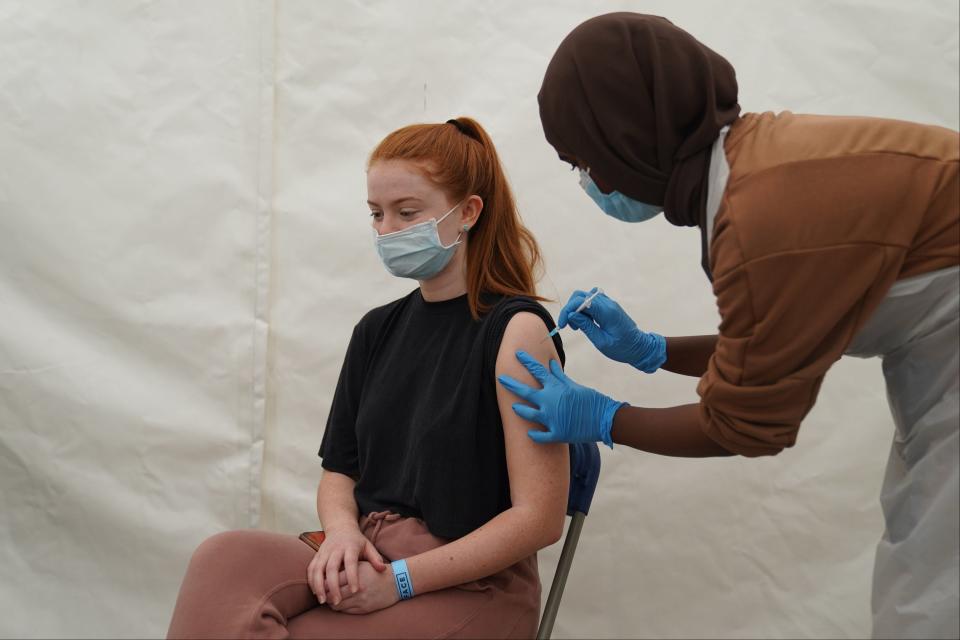 A person receives a Covid-19 jab at a pop-up vaccination centre in Langdon Park, Poplar (PA)