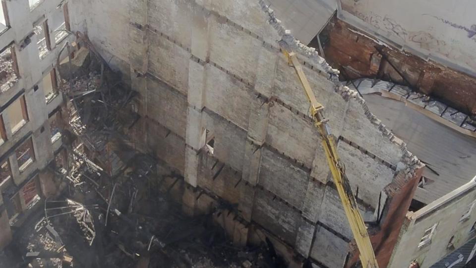 The walls were knocked down from top to bottom by an excavator. Photo: Fire and Rescue NSW