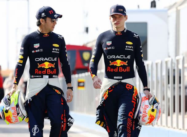 PHOTO: Sergio Perez of Mexico and Oracle Red Bull Racing and Max Verstappen of the Netherlands and Oracle Red Bull Racing talk during day one of F1 Testing at Bahrain International Circuit on Feb. 23, 2023 in Bahrain, Bahrain. (Mark Thompson/Getty Images, FILE)