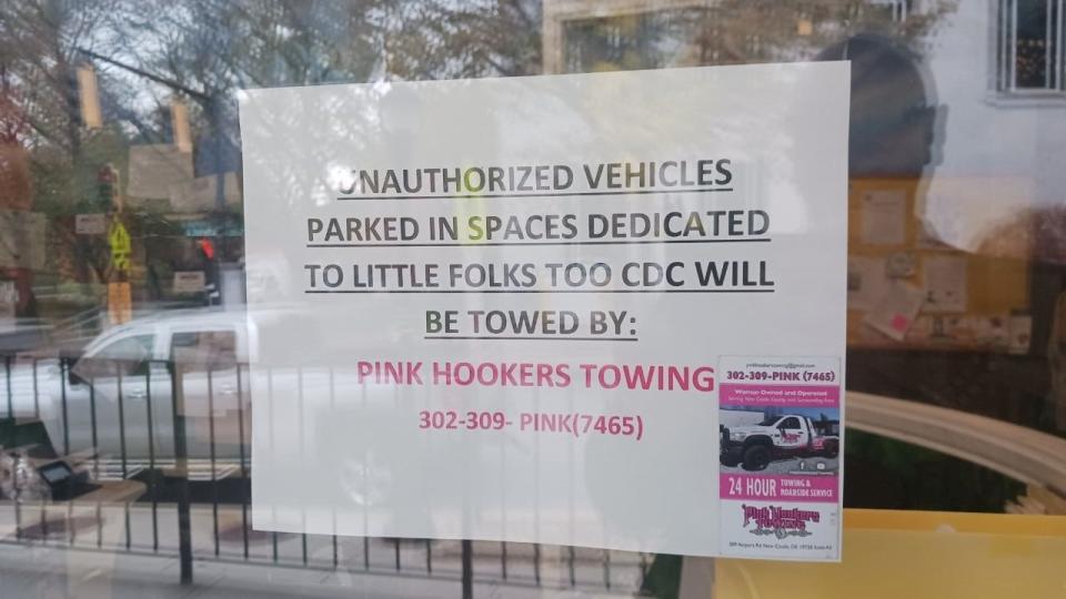 A sign posted inside the Little Folks Too Daycare center at 1320 N. Market St. informs drivers that cars will be towed by Pink Hookers Towing. Wilmington officials requested the day care center removed the signs on Monday, Nov. 13, 2023.