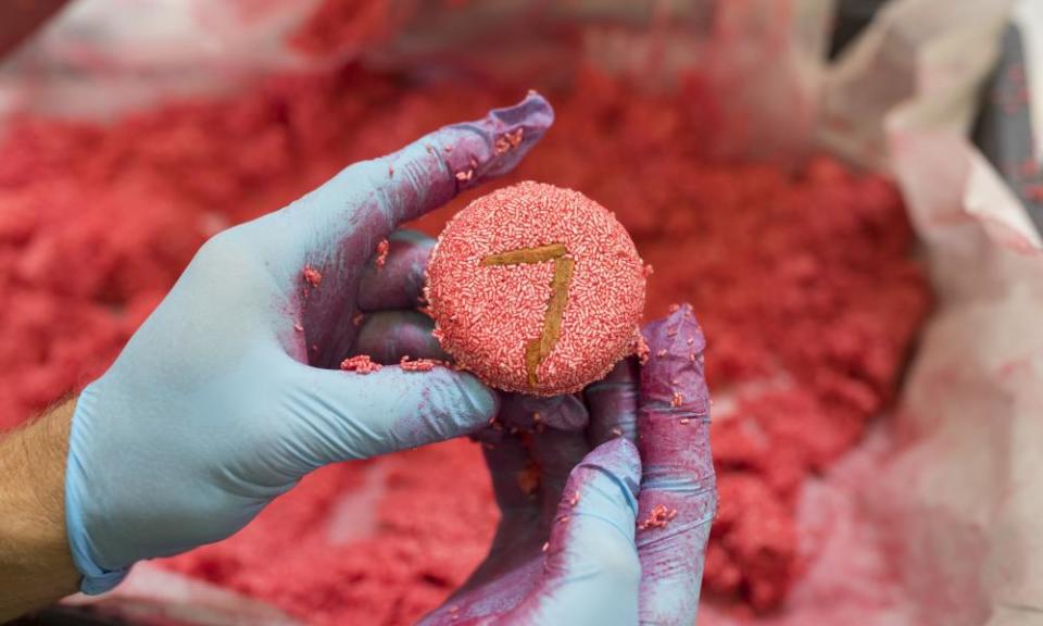 An employee holds a “New” shampoo bar on the production line at the Lush Cosmetics Ltd. hand made cosmetics factory in Duesseldorf, Germany, on Tuesday, July 19, 2016.