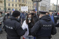 Demonstrators gather to protest the COVID-19 preventative measures downtown Prague, Czech Republic, Wednesday, Oct. 28, 2020. Coronavirus infections in the Czech Republic have again jumped to record levels amid new restrictive measures imposed by the government to curb the spread. (AP Photo/Petr David Josek)