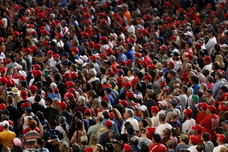 Members of the audience look on as U.S. President Donald Trump delivers remarks at a Keep America Great rally at the Santa Ana Star Center in Rio Rancho, New Mexico