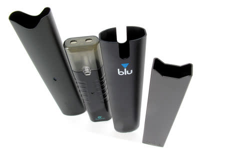 An electronic cigarette device made by JUUL (R) is shown next to other similar devices (L to R) Vuse Alto, Suorin ishare and myblu in this photo illustration taken September 20, 2018. REUTERS/Mike Blake/Illustration