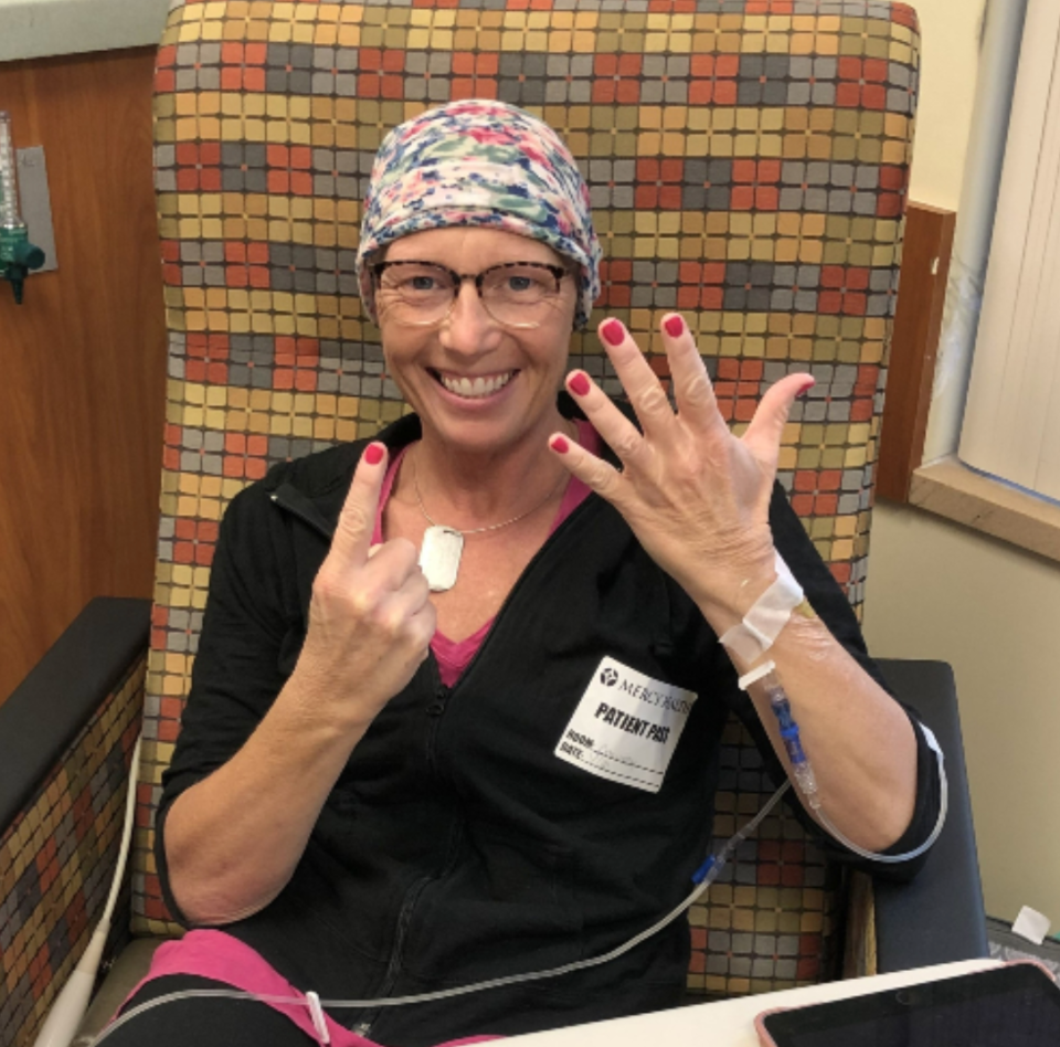 Jennifer Brouwer smiles as she prepares for her final round of chemotherapy in July 2021.