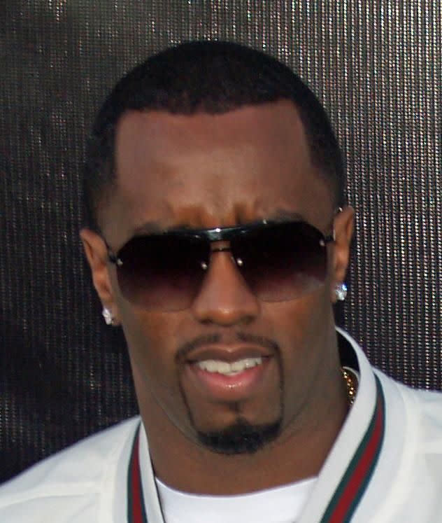 An up close photo of Sean Combs aka Diddy drowning his face. 