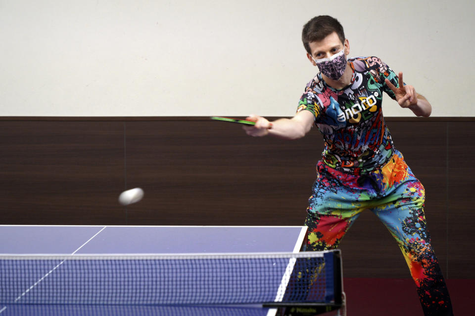 Adam Bobrow, lead commentator for the International Table Tennis Federation, plays at Akiba Takkyu Style, in Tokyo, Japan, on Thursday, Aug. 5, 2021. Bobrow, the Voice of Table Tennis, possesses an arsenal of tricky spin shots, captured on YouTube and watched by millions, that can leave even good opponents gape-mouthed and then, as the wildness of what they’ve seen sinks in, delighted. What he really likes, though, is to travel the world as a sort of ambassador for the sport. (AP Photo/Kantaro Komiya)