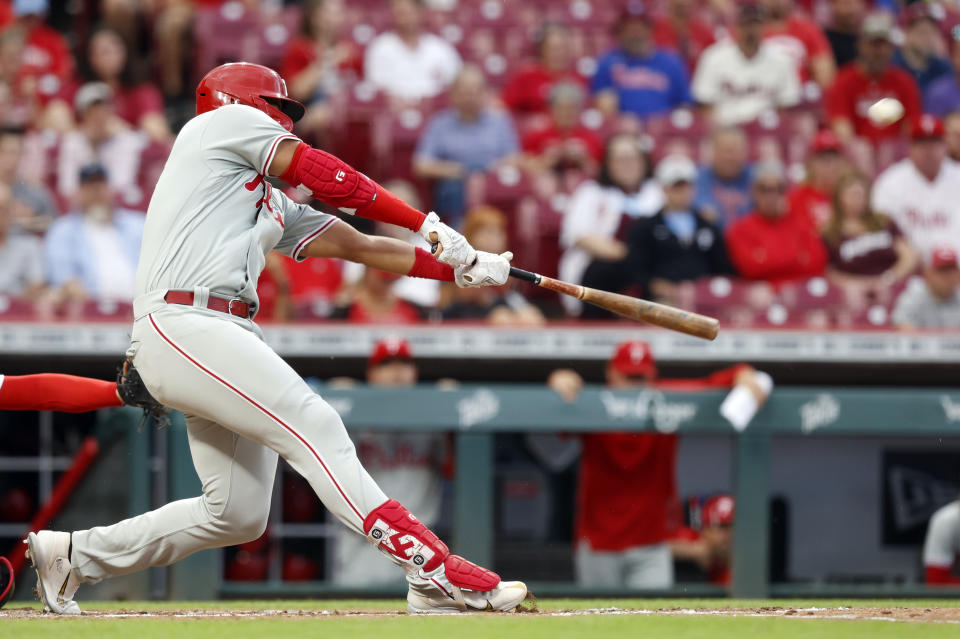 Philadelphia Phillies Darick Hall hits a home run against the Cincinnati Reds during the third inning of a baseball game in Cincinnati on Tuesday, Aug. 16, 2022. (AP Photo/Paul Vernon)