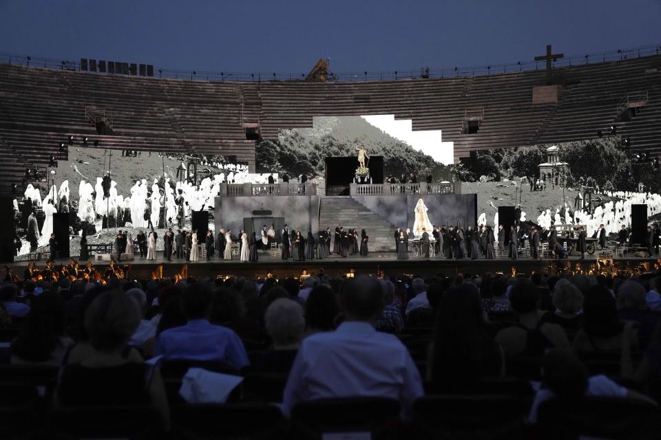 A view of the stage during 'Cavalleria Rusticana' lyric opera, at the Arena di Verona theatre, in Verona, Italy, Friday, June 25, 2021. The Verona Arena amphitheater returns to staging full operas for the first time since the pandemic struck but with one big difference. Gone are the monumental sets that project the scene to even nosebleed seats in the Roman-era amphitheater, replaced by huge LED screens with dynamic, 3D sets that are bringing new technological experiences to the opera world. (AP Photo/Luca Bruno)