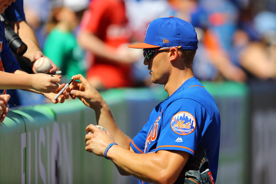 <p>New York Mets outfielder Brandon Nimmo signs for fans before the baseball game against the St. Louis Cardinals at First Data Field in Port St. Lucie, Fla., Feb. 24, 2018. (Photo: Gordon Donovan/Yahoo News) </p>