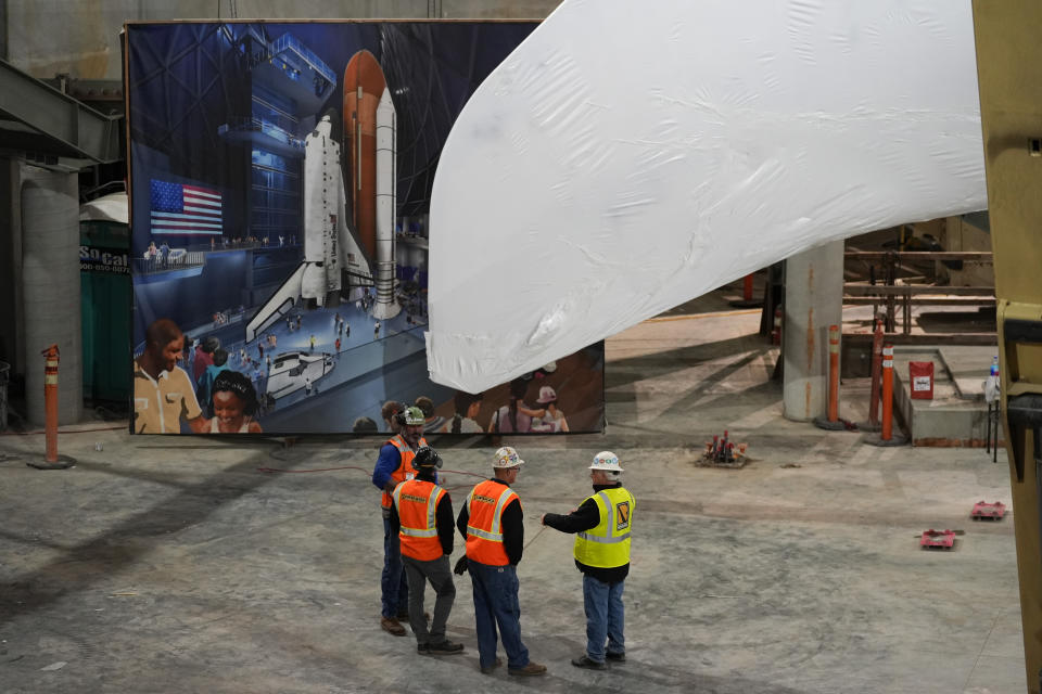 Space Shuttle Endeavour is lifted into the site of the future Samuel Oschin Air and Space Center on Tuesday, Jan. 30, 2024, in Los Angeles. (AP Photo/Ashley Landis)