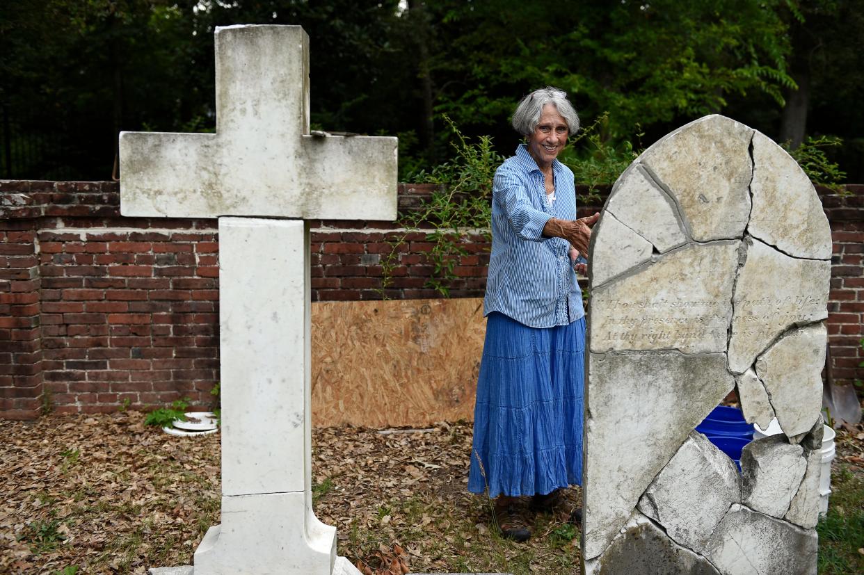 Anne Sherman, who has helped lead an effort to clean and maintain Cottage Cemetery off Marvin Griffin Road, talks about some of the restoration work on headstones and graves in this photo from 2015.