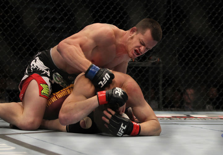 LAS VEGAS, NV - MAY 26: CB Dollaway (top) punches Jason Miller during a middleweight bout at UFC 146 at MGM Grand Garden Arena on May 26, 2012 in Las Vegas, Nevada.