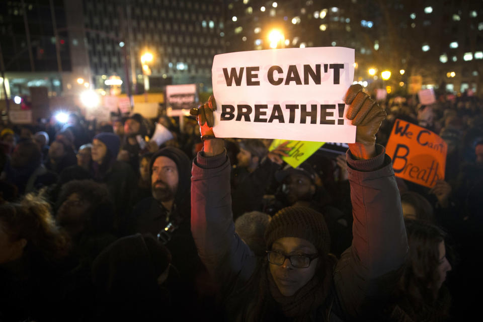 Demonstrators participate in a rally against a grand jury's decision not to indict the police officer involved in the death of Eric Garner, Thursday, Dec. 4, 2014, in New York. A grand jury cleared a white New York City police officer Wednesday in the videotaped chokehold death of Garner, an unarmed black man, who had been stopped on suspicion of selling loose, untaxed cigarettes. (AP Photo/John Minchillo)