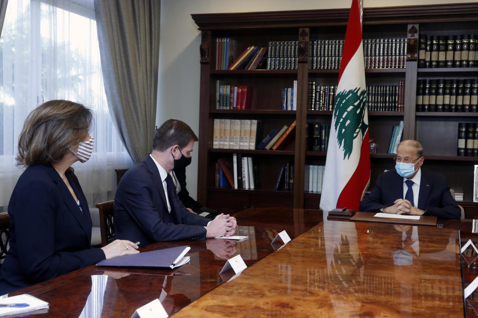 In this photo released by the Lebanese government, Lebanese President Michel Aoun, right, meets with U.S. Undersecretary of State for Political Affairs David Hale, center, and, U.S. Ambassador to Lebanon Dorothy Shea, left, at the presidential palace, in Baabda, east of Beirut, Lebanon, Thursday, April 15, 2021. (Dalati Nohra/Lebanese Official Government via AP)