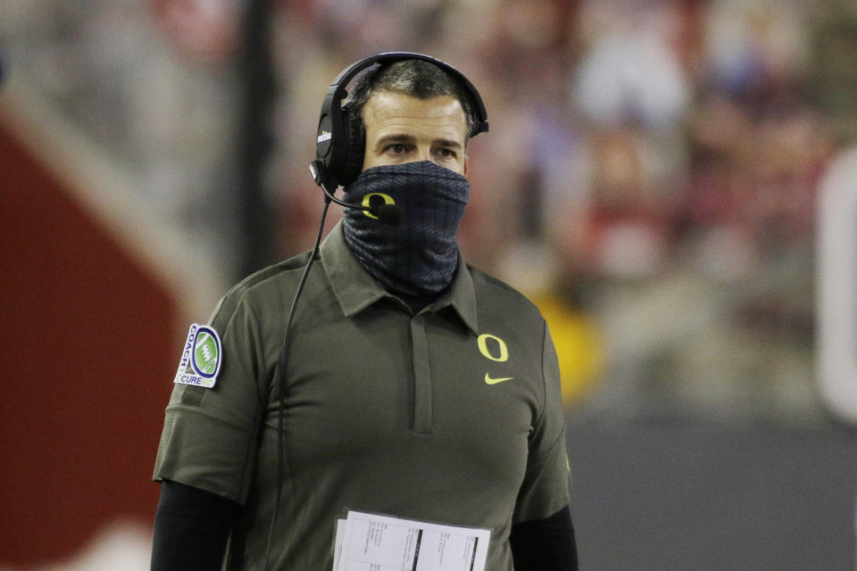 Oregon coach Mario Cristobal walks along the sideline during the first half of the team's NCAA college football game against Washington State in Pullman, Wash., Saturday, Nov. 14, 2020. (AP Photo/Young Kwak)