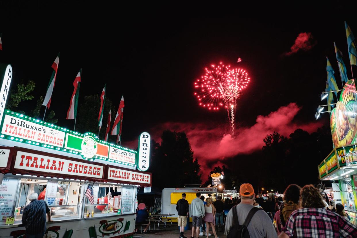 People take in the fireworks show during the last day of the First Town Days Festival in New Philadelphia's Tuscora Park in 2021.