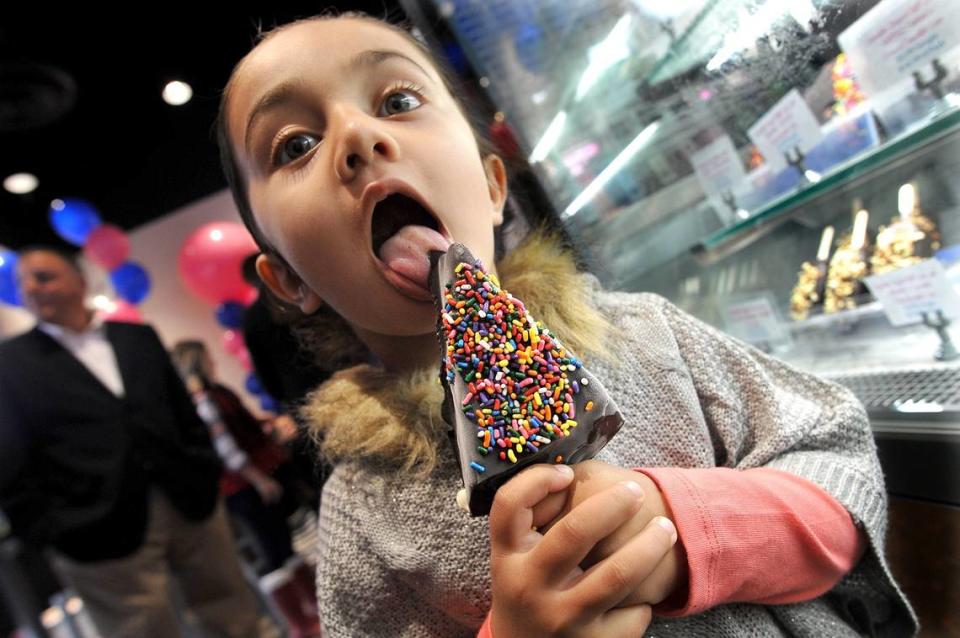 Avani Gill, 3, samples a sprinkle-covered ice cream Polar Pizza bar during the grand opening ceremonies of a new Baskin Robbins on Milburn Avenue, the first in the country in the new presentation of the ice cream shop in this Fresno Bee file photo from 2018.