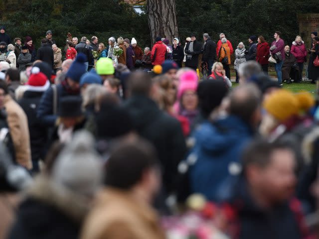 Crowds gather outside St Mary Magdalene Church