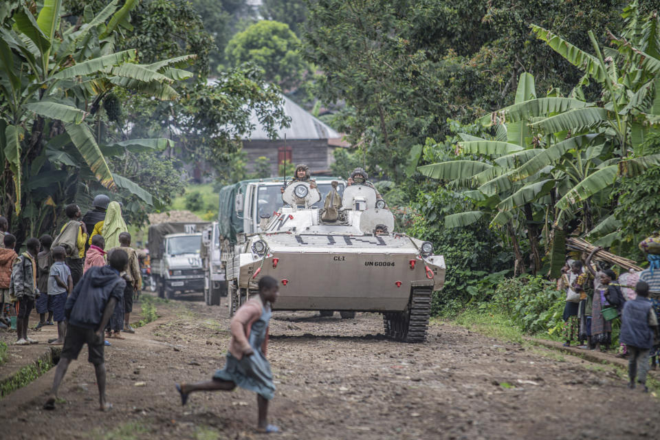 MONUSCO blue helmet deployed near Kibumba, north of Goma, Democratic Republic of Congo, Friday Jan. 28, 2022. Thousands of people in the Democratic Republic of Congo have been displaced after they fled ongoing clashes between the Congolese army and M23 fighters this week. (AP Photo/Moses Sawasawa)