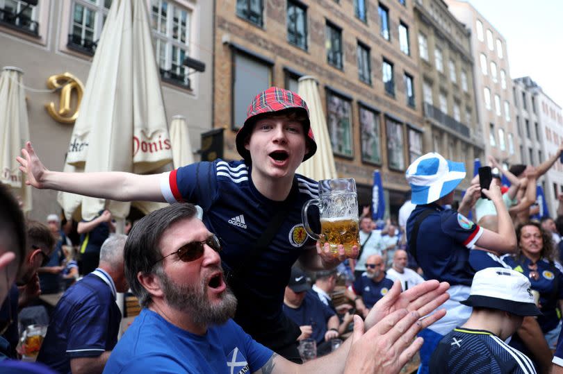 A Scotland fan dons a tartan cap as he joins supporters in Marientplatz, Munich, ahead of the Euro 2024 games