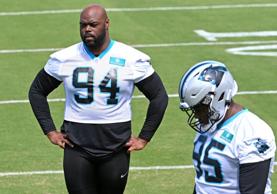 Carolina Panthers defensive end A’Shawn Robinson, left, watches his teammates run through a drill during the team’s voluntary minicamp practice on Wednesday, April 24, 2024.