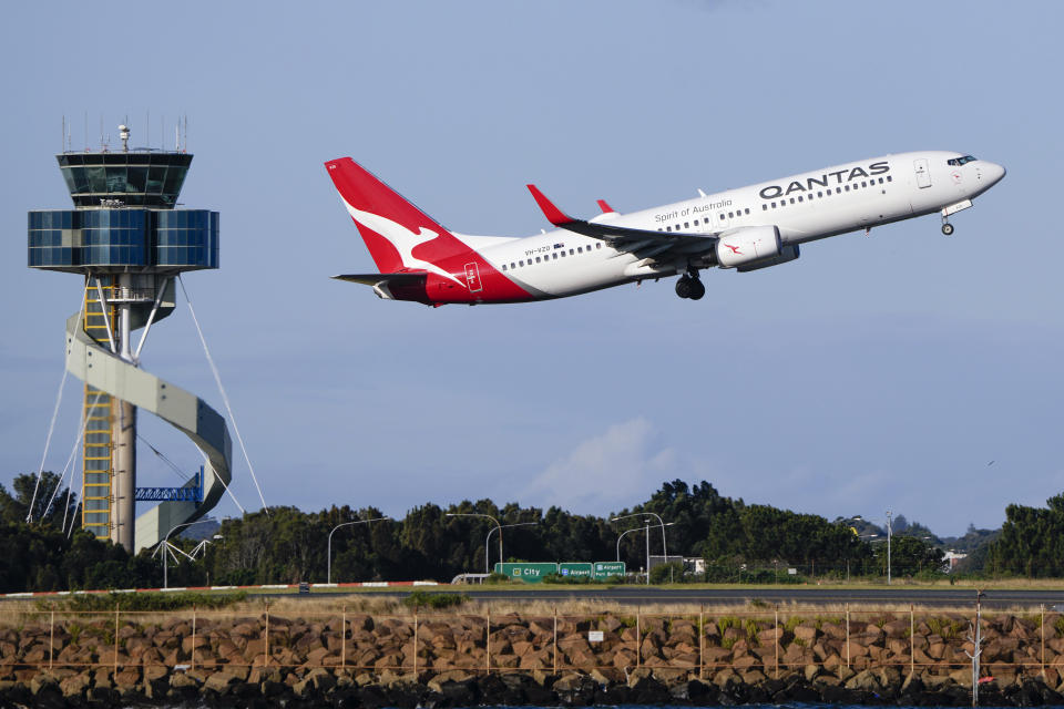A Qantas Boeing 737 passenger plane takes off from Sydney Airport. 