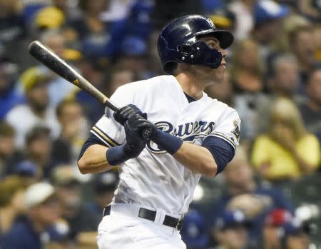 Jul 21, 2018; Milwaukee, WI, USA; Milwaukee Brewers left fielder Christian Yelich (22) hits a solo home run in the sixth inning against the Los Angeles Dodgers at Miller Park. Mandatory Credit: Benny Sieu-USA TODAY Sports