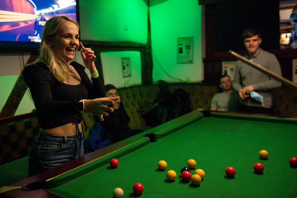 <p>Customers enjoy a game of pool at the The Oak Inn in Coventry, West Midlands, as indoor hospitality and entertainment venues reopen to the public following the further easing of lockdown restrictions in England. Picture date: Monday May 17, 2021.</p>
