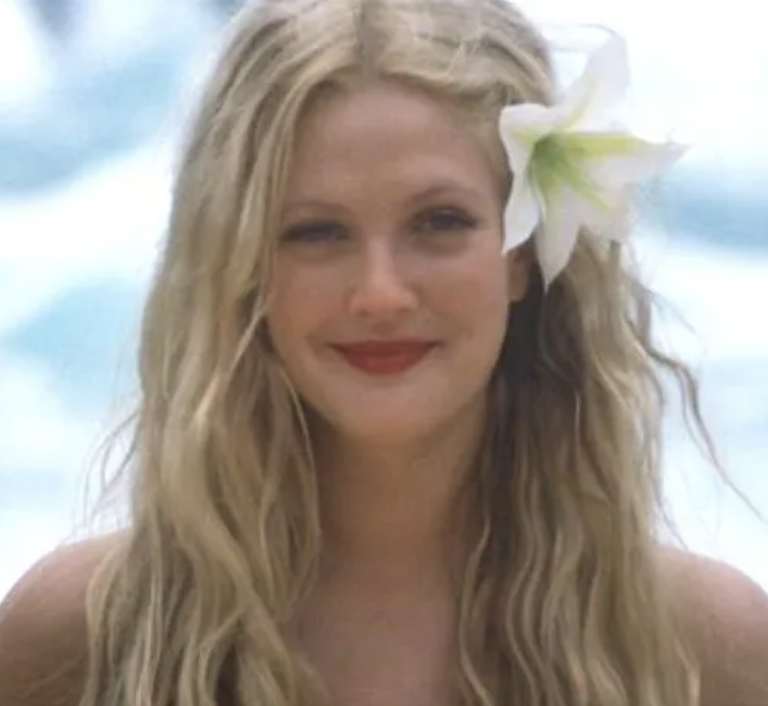 a woman with a flower in her hair