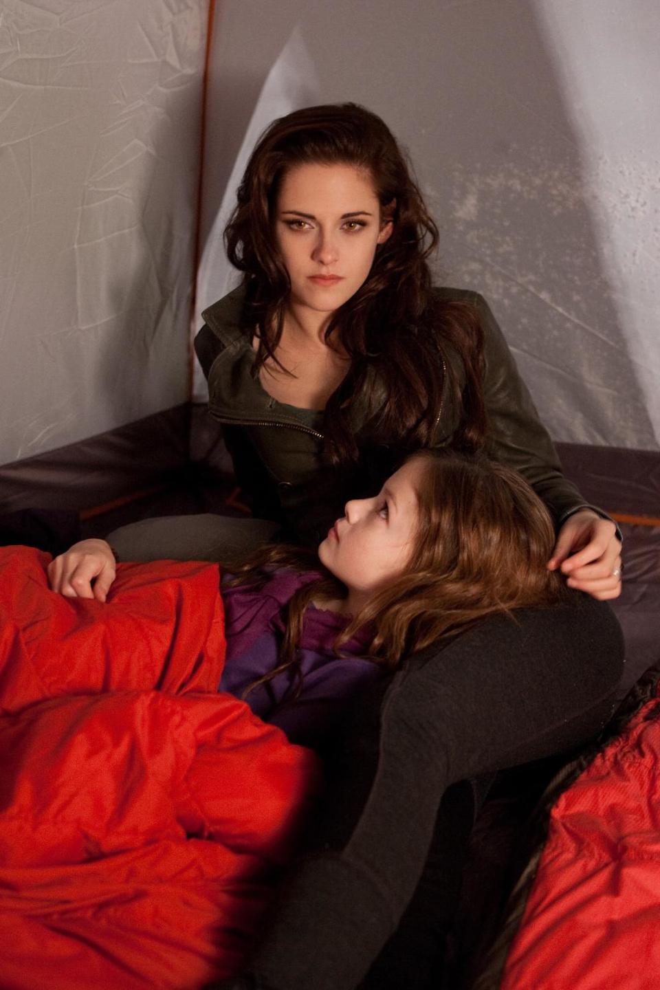 FILE - This file film image provided by Summit Entertainment shows actresses Mackenzie Foy, foreground, and Kristen Stewart in a scene from "The Twilight Saga: Breaking Dawn Part 2." The finale to the blockbuster supernatural romance dominated the 33rd Annual Razzie Awards on Saturday, Feb. 23, 2013 with seven awards, including worst actress for Kristen Stewart, supporting actor for Taylor Lautner, director for Bill Condon and worst screen couple for Lautner and child co-star Mackenzie Foy. (AP Photo/Summit Entertainment, Andrew Cooper, SMPSP, File)