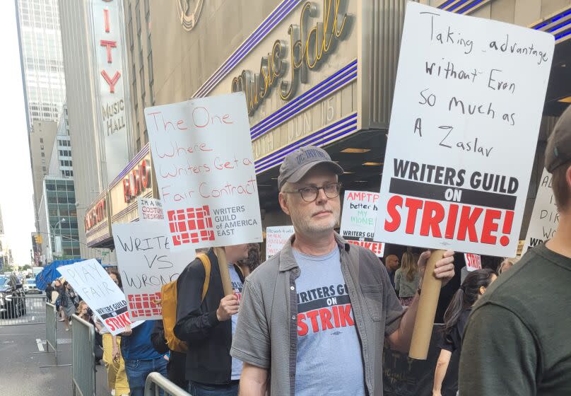 WGA members picket at Radio City Music Hall in New York City during NBCUniversal upfront presentation.