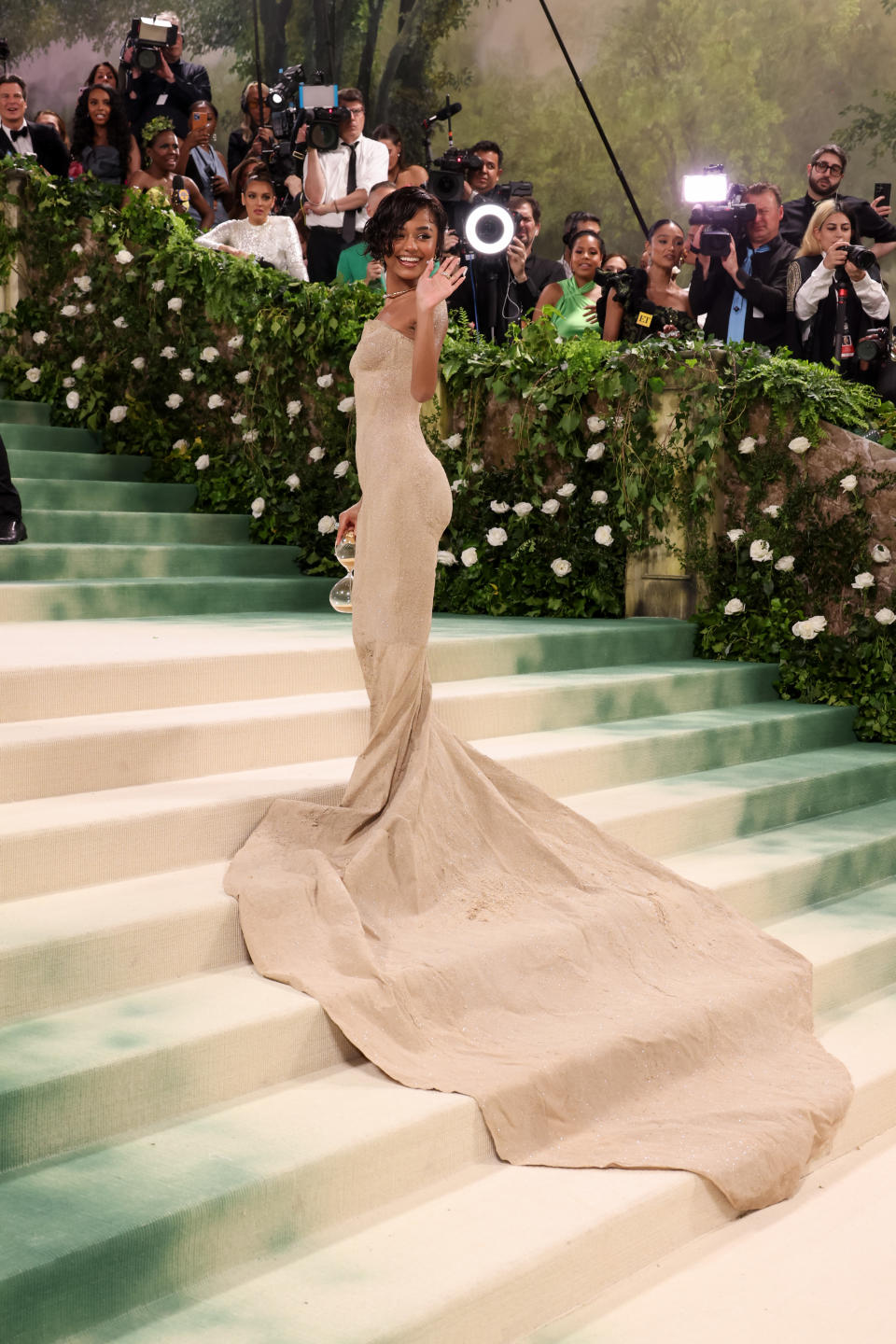 Tyla posing on the Met Gala steps showing her gown's long train