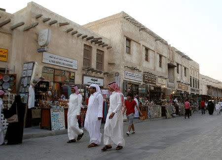 Men walk at Souq Waqif market in Doha, Qatar August 30, 2016. REUTERS/Naseem Zeitoon