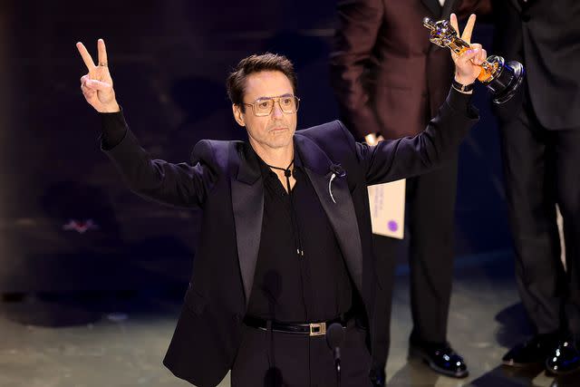 <p>Kevin Winter/Getty</p> Robert Downey Jr. accepts the Best Supporting Actor award at the 96th Annual Academy Awards on March 10 in Hollywood, Calif.